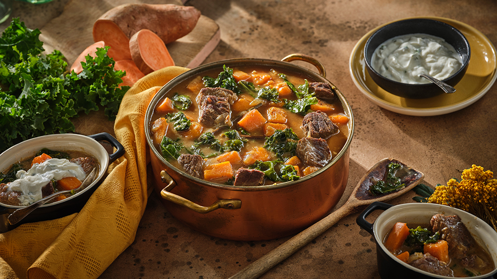 Beef and sweet potato stew in gold pot