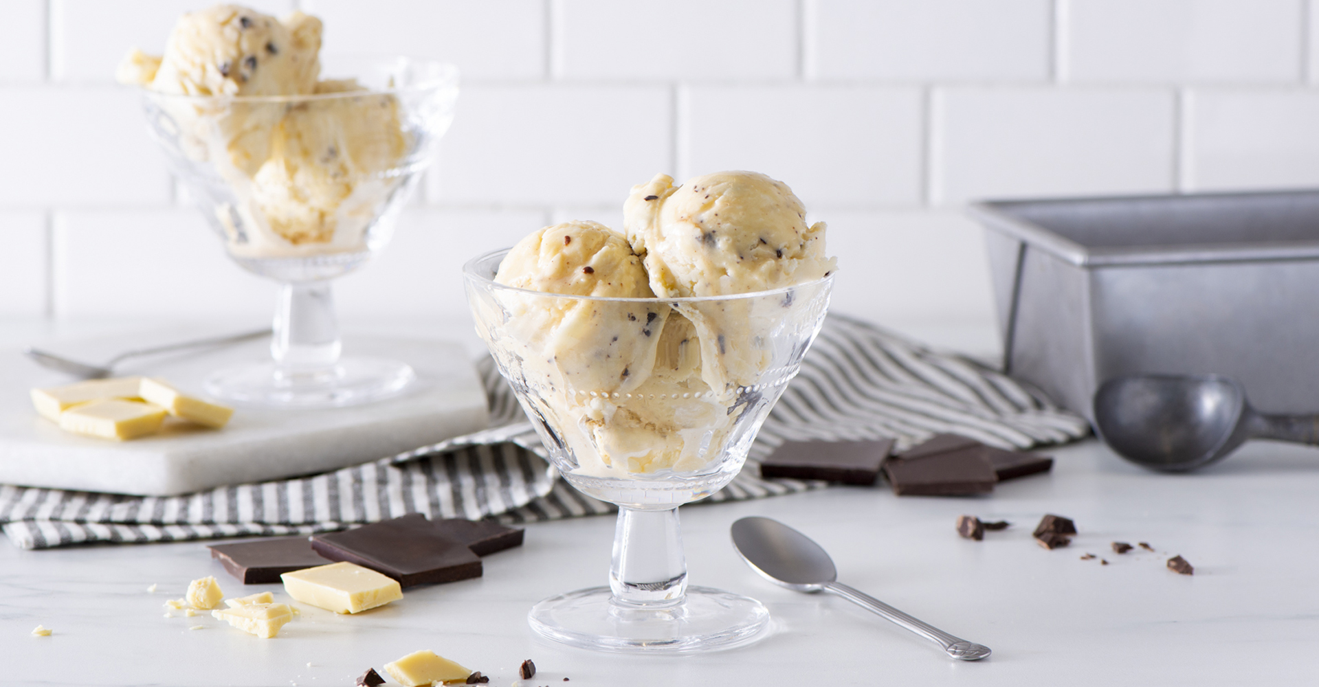 Double Chocolate Truffle Ice Cream scooped into glass dishes with spoons.